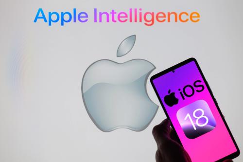 Apple iOS 18 is being displayed on a smartphone, with Apple Intelligence in the background, in this photo illustration in Brussels, Belgium, on June 11, 2024.