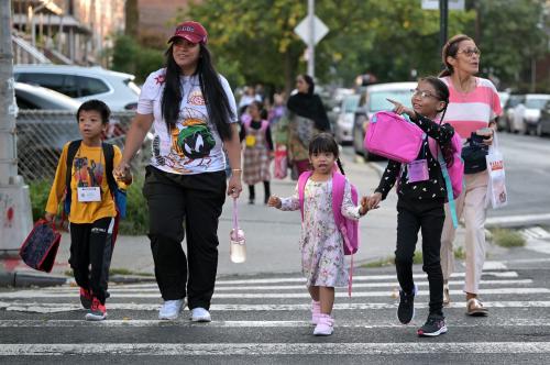 Accompanied by family members, children arrive back to school on the first day of the 2024-2025 City Public School year, in the Queens borough of New York City, NY, September 5, 2024.