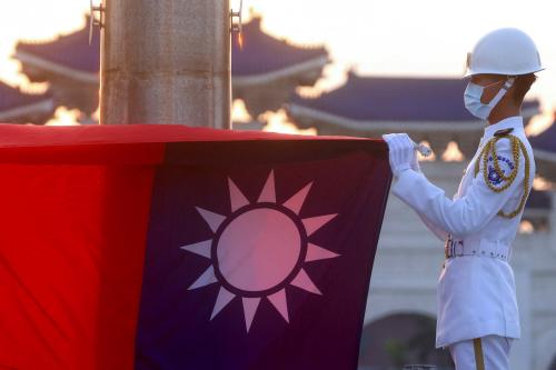 Honour guards lower the Taiwan flag during sunset hours at Liberty Square in Taipei, Taiwan, July 28, 2022.