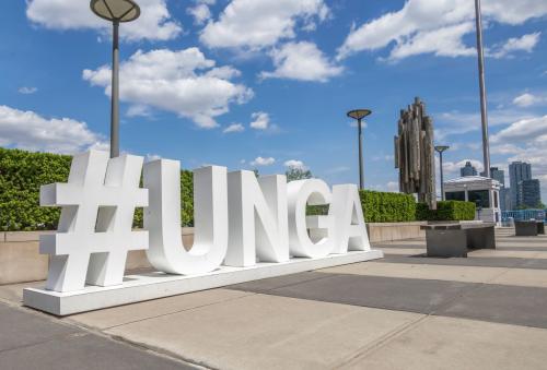 A sculpture in the shape of "#UNGA" on the sidewalk